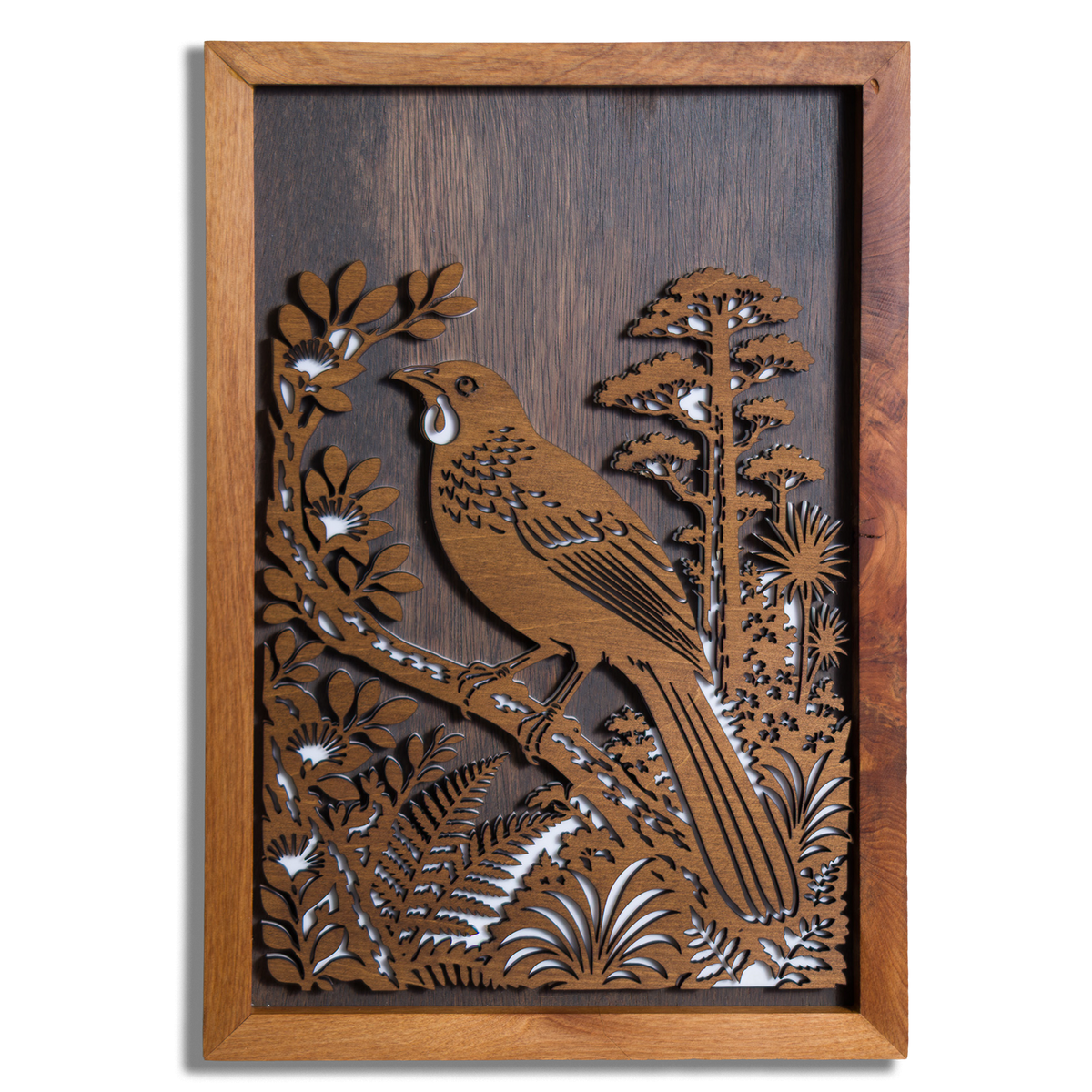 North Island kōkako layered timber wall art in a macrocarpa frame, front view