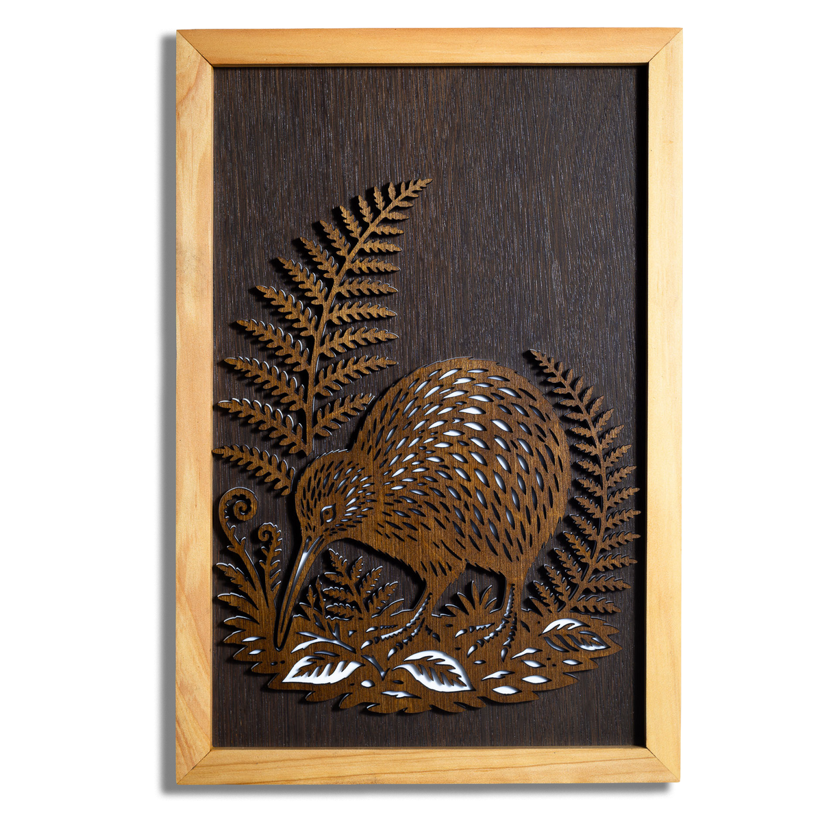 Kiwi layered timber wall art with silver fern in a macrocarpa frame, front view