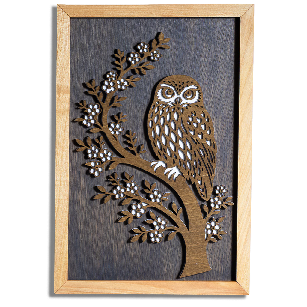 Morepork ruru layered timber wall art in a macrocarpa frame, front view