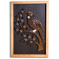Tūī layered timber wall art in a macrocarpa frame, front view