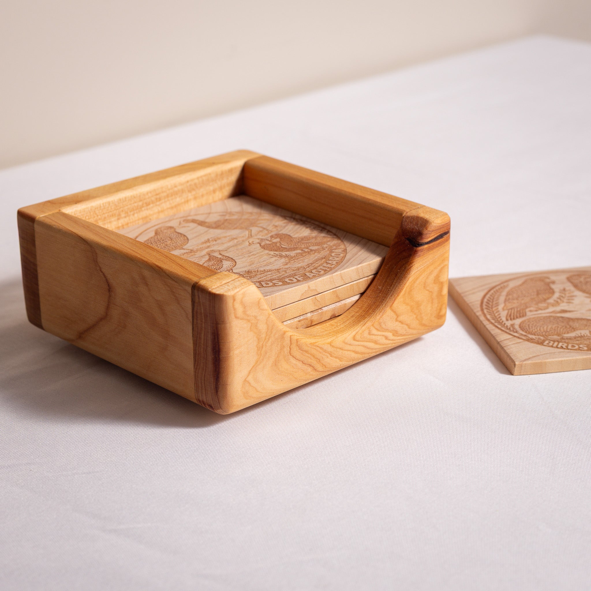 Birds of Aotearoa Coaster Set – Handmade NZ Macrocarpa Timber | Set of 5 + Holder