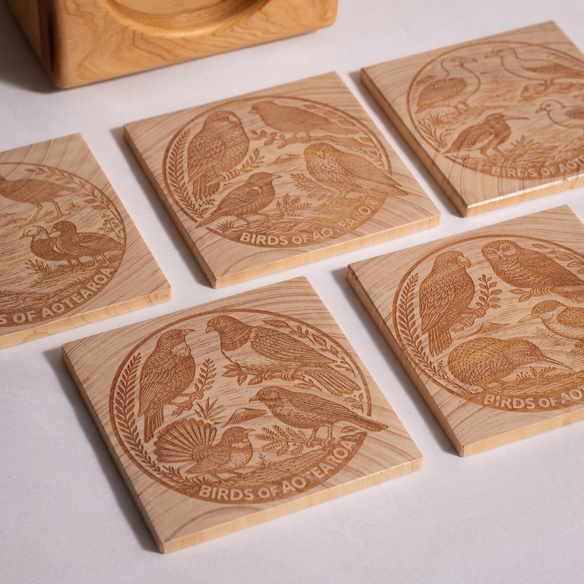 Birds of Aotearoa Coaster Set – Handmade NZ Macrocarpa Timber | Set of 5 + Holder