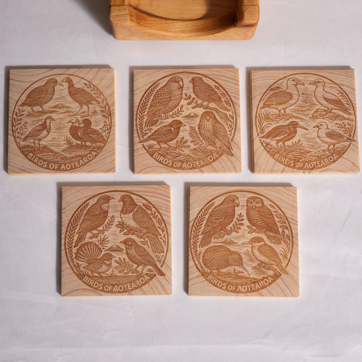 Birds of Aotearoa Coaster Set – Handmade NZ Macrocarpa Timber | Set of 5 + Holder