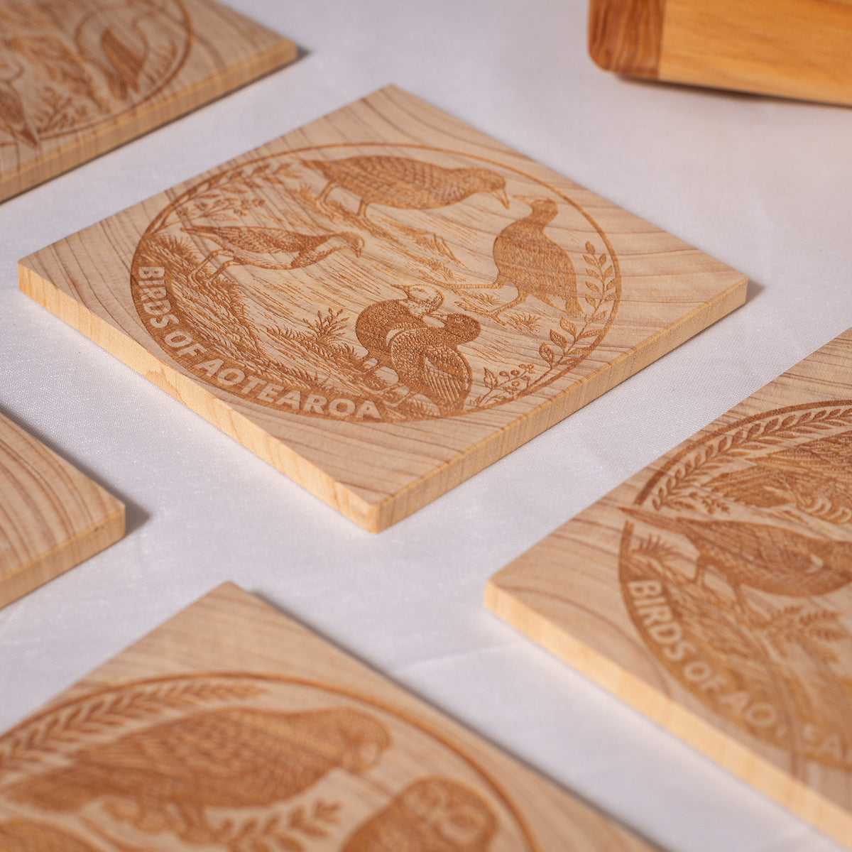 Birds of Aotearoa Coaster Set – Handmade NZ Macrocarpa Timber | Set of 5 + Holder