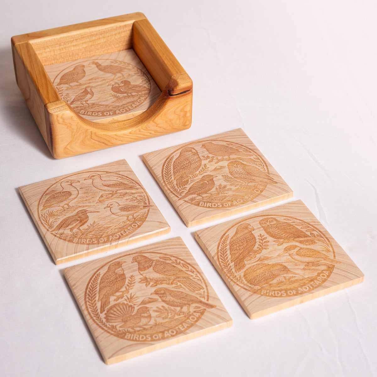 Birds of Aotearoa Coaster Set – Handmade NZ Macrocarpa Timber | Set of 5 + Holder