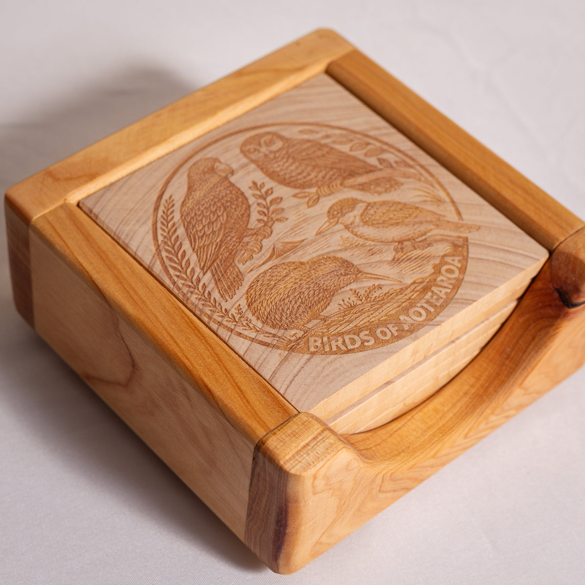 Birds of Aotearoa Coaster Set – Handmade NZ Macrocarpa Timber | Set of 5 + Holder