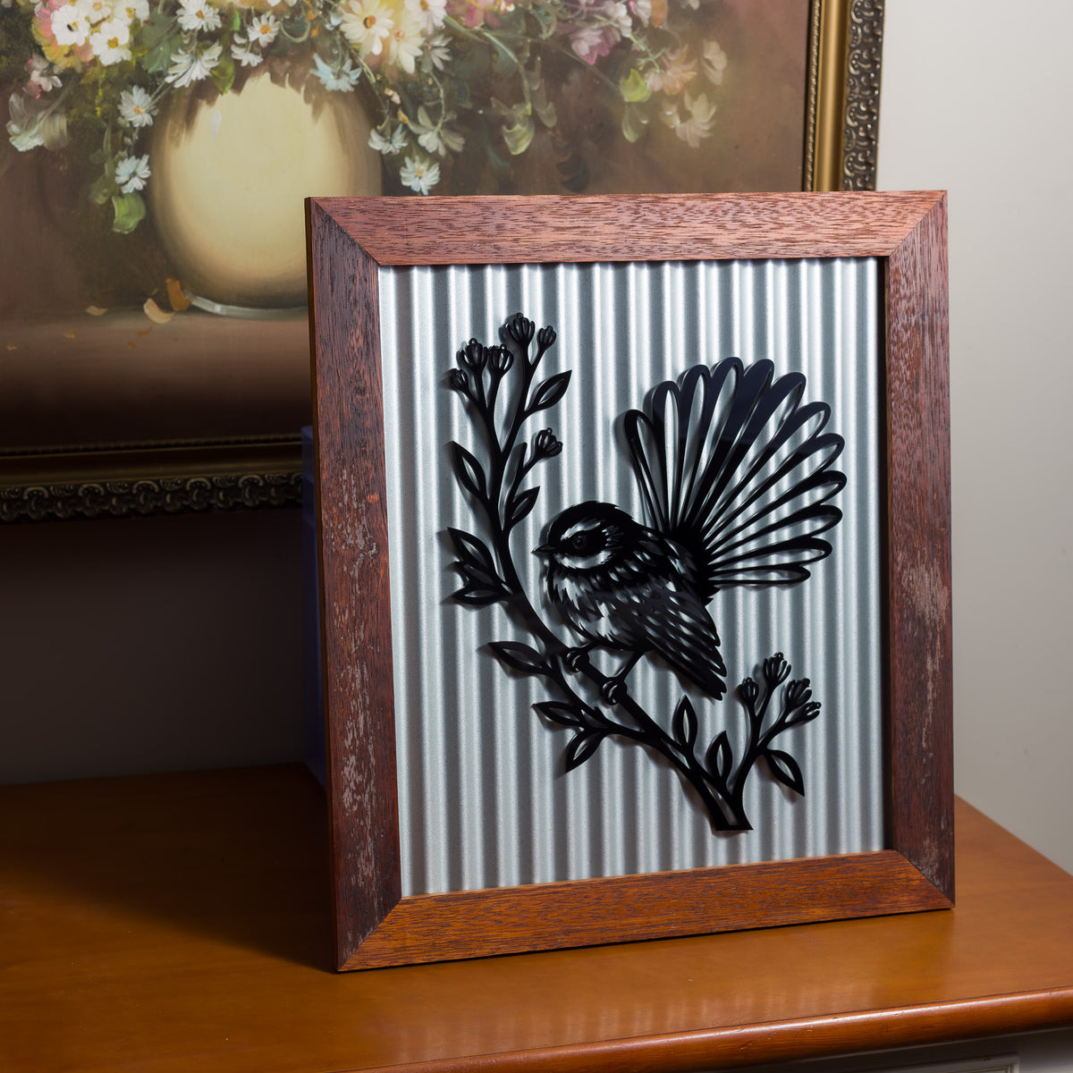 Pīwakawaka Fantail Outdoor Wall Art – Corrugated Metal & Black Acrylic – Kwila Frame