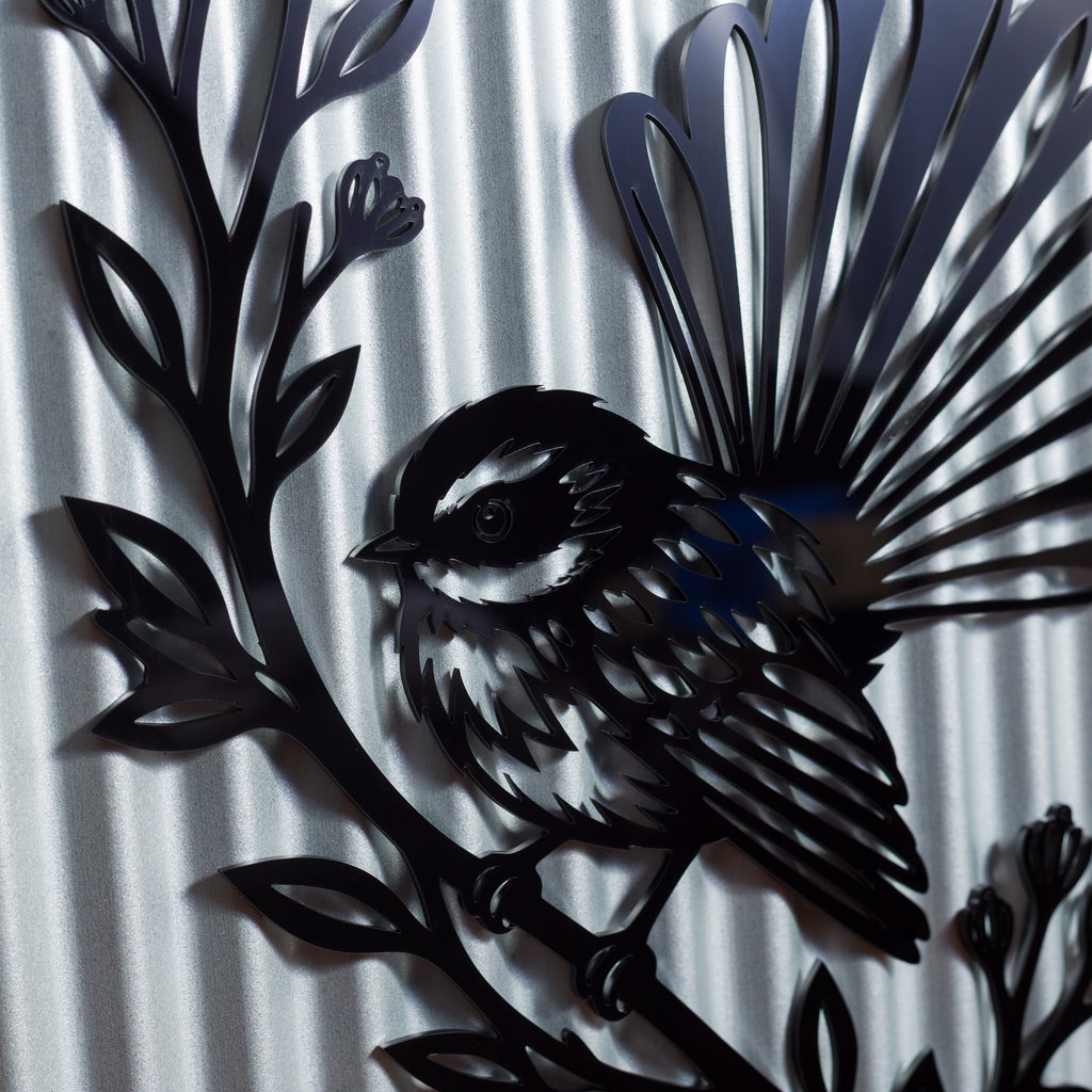 Pīwakawaka Fantail Outdoor Wall Art – Corrugated Metal & Black Acrylic – Kwila Frame