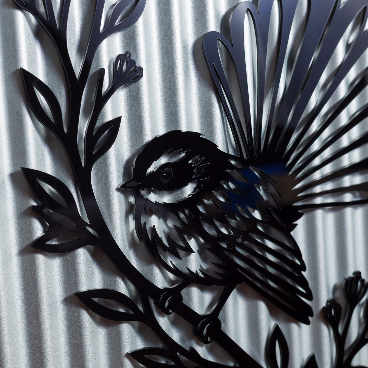 Pīwakawaka Fantail Outdoor Wall Art – Corrugated Metal & Black Acrylic – Kwila Frame